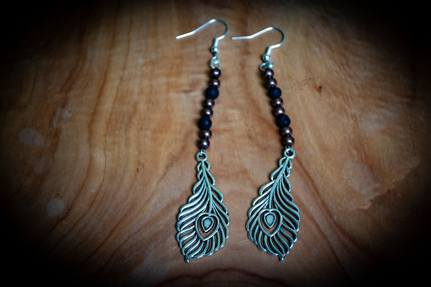 Pair of Silver Lava Rock and Copper Bead Peacock Feather Boho Earrings